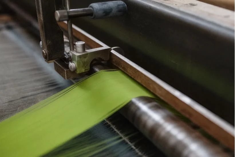 Fraying Fibers Microscope view of woven polyester fibers unraveling