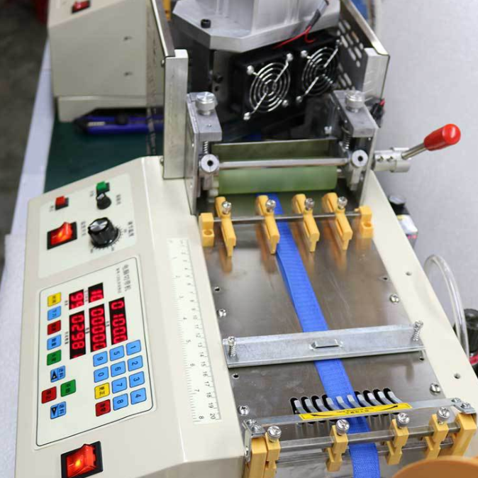 Organized nylon webbing rolls prepared for efficient material cutting and production planning