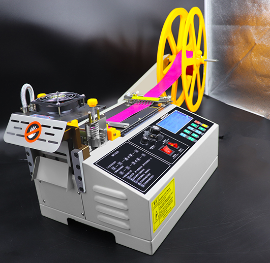 Industrial webbing cutting machine operator checking angle accuracy