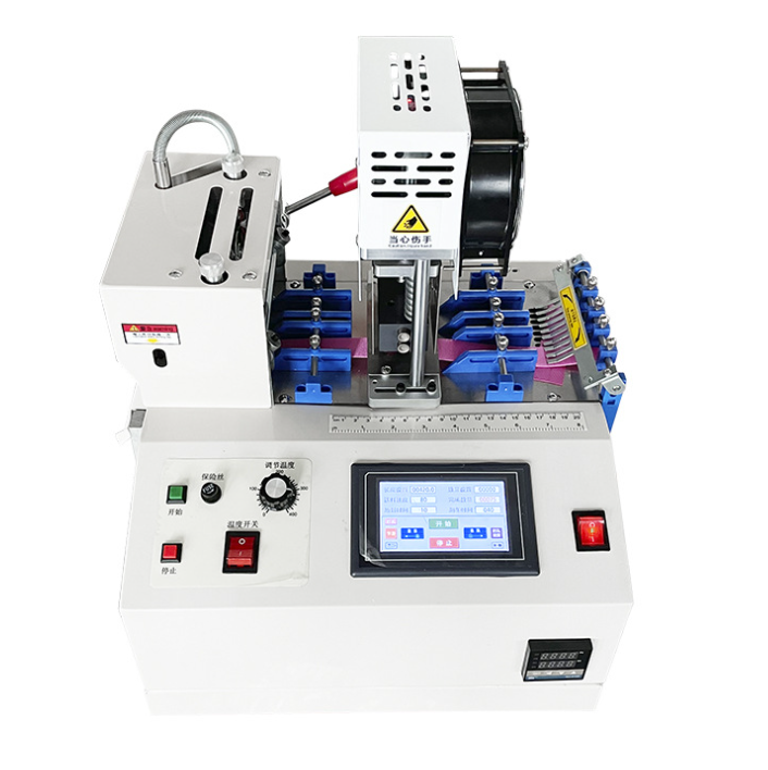 Operator inspecting webbing cutting samples for angle and length accuracy
